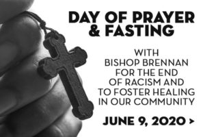 Hand with Rosary for day of prayer and fasting on june 9