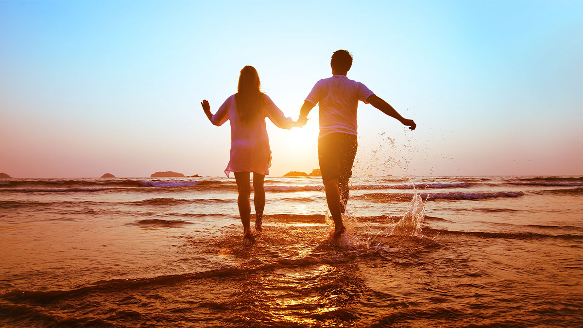 couple-having-fun-at-the-beach - St Gabriel Catholic Radio