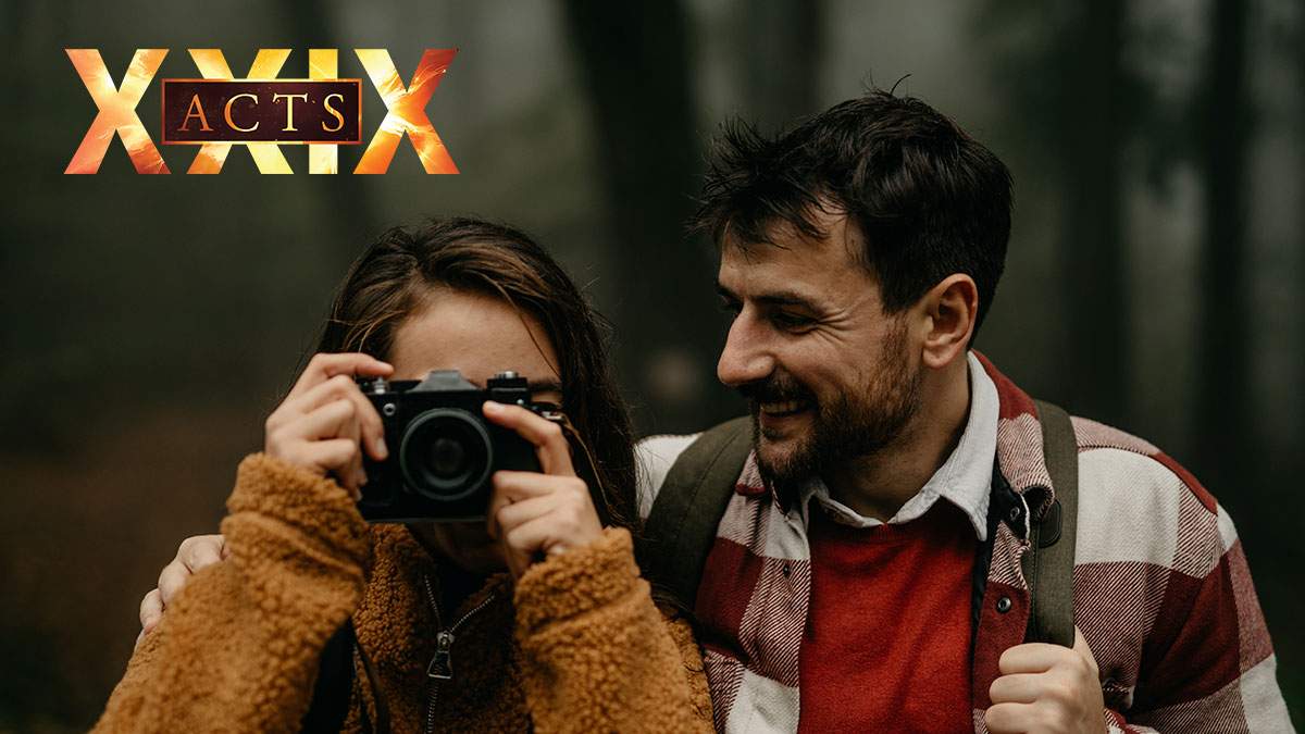 Acts29-Marriage-thru-the-Lens-of-Scripture loving Married couple looking through camera