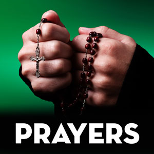 Hands holding rosary beads for prayers recorded by St. Gabriel Radio