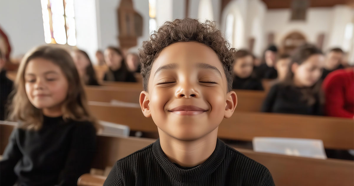 Young child praying in church